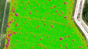 Drone flying over a mining site during a geophysical survey for mineral exploration
