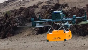 Drone flying over a mining site during a geophysical survey for mineral exploration