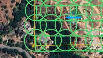Drone carrying a magnetometer sensor surveying an archaeological site