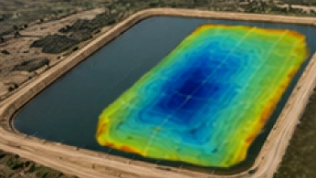 Drone carrying a magnetometer sensor surveying an archaeological site