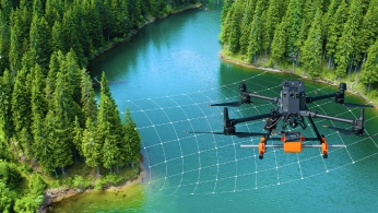 Drone flying over a mining site during a geophysical survey for mineral exploration