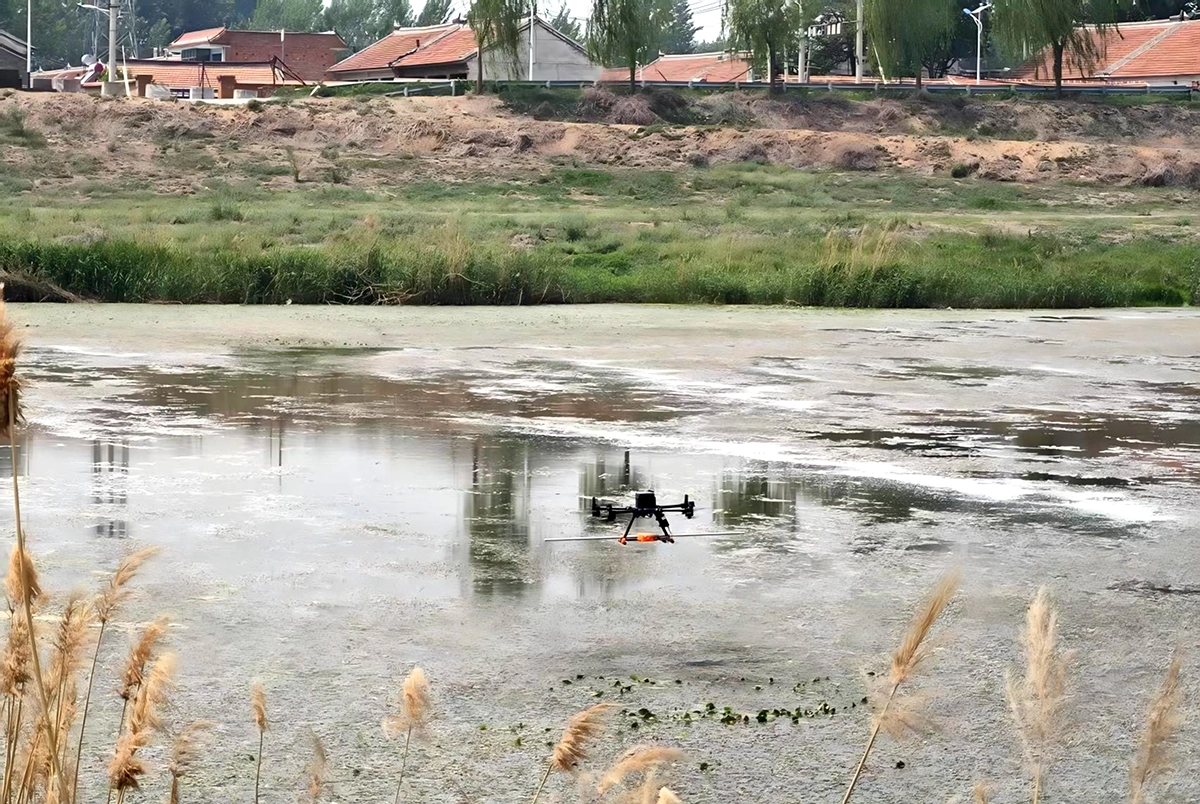 Drone-mounted GPR system surveying a vegetation-covered river section in China.