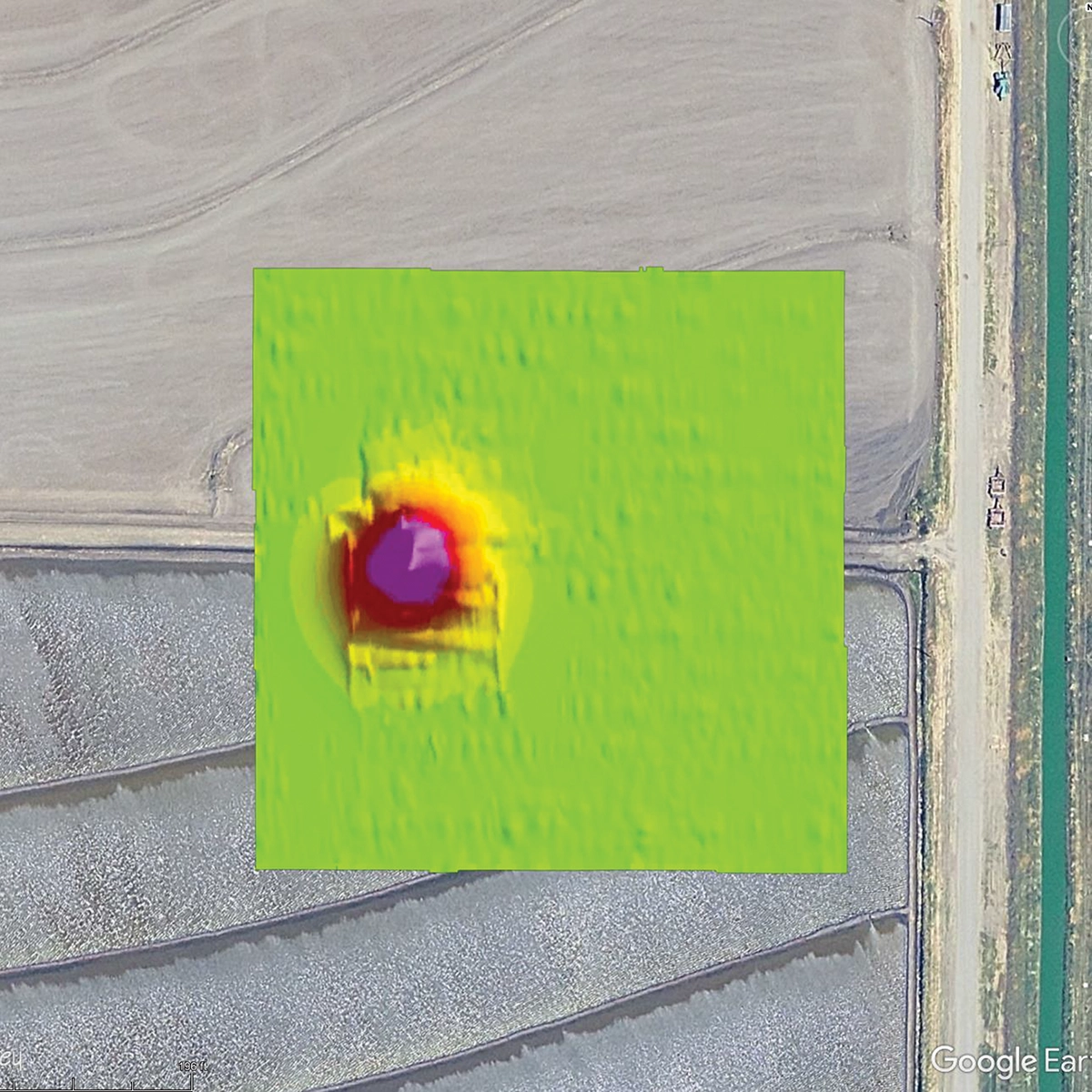 UAV magnetic anomaly map showing a detected abandoned gas well beneath agricultural fields.