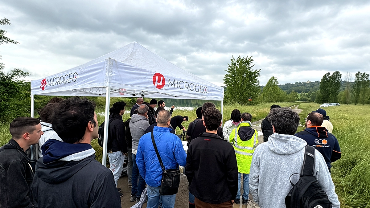 Industry professionals and enthusiasts attending a drone technology workshop during the MicroGeo and SPH Engineering Demo Day in Italy.