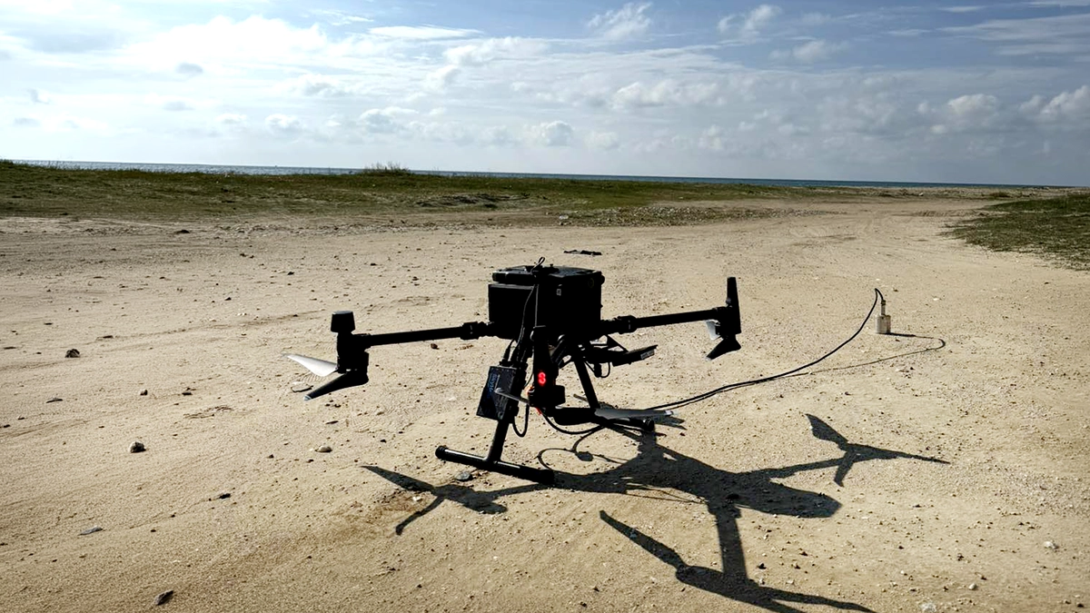 DJI Matrice 300 RTK with a drone-based bathymetry kit prepared on the beach before a coastal survey in Greece.