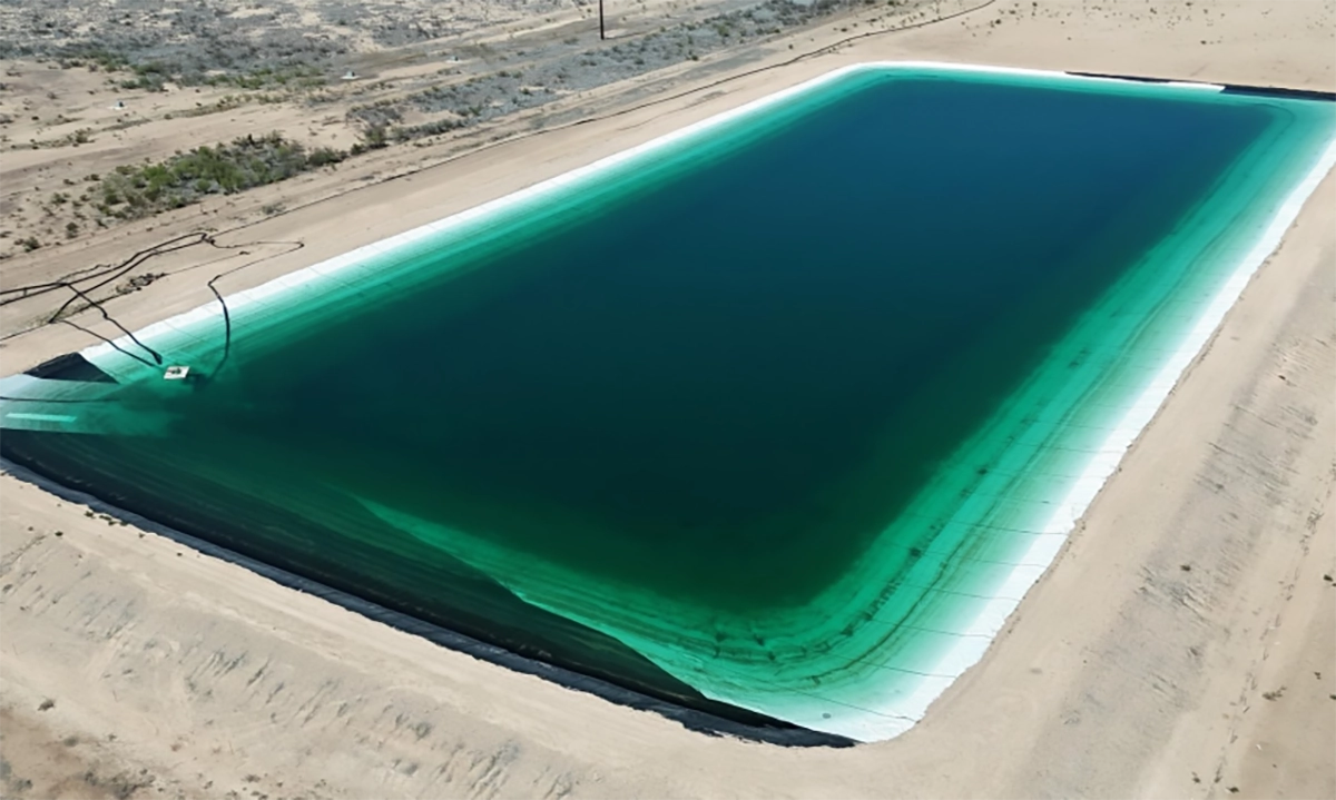 Aerial view of a lined frac pond in West Texas used for oilfield water storage.