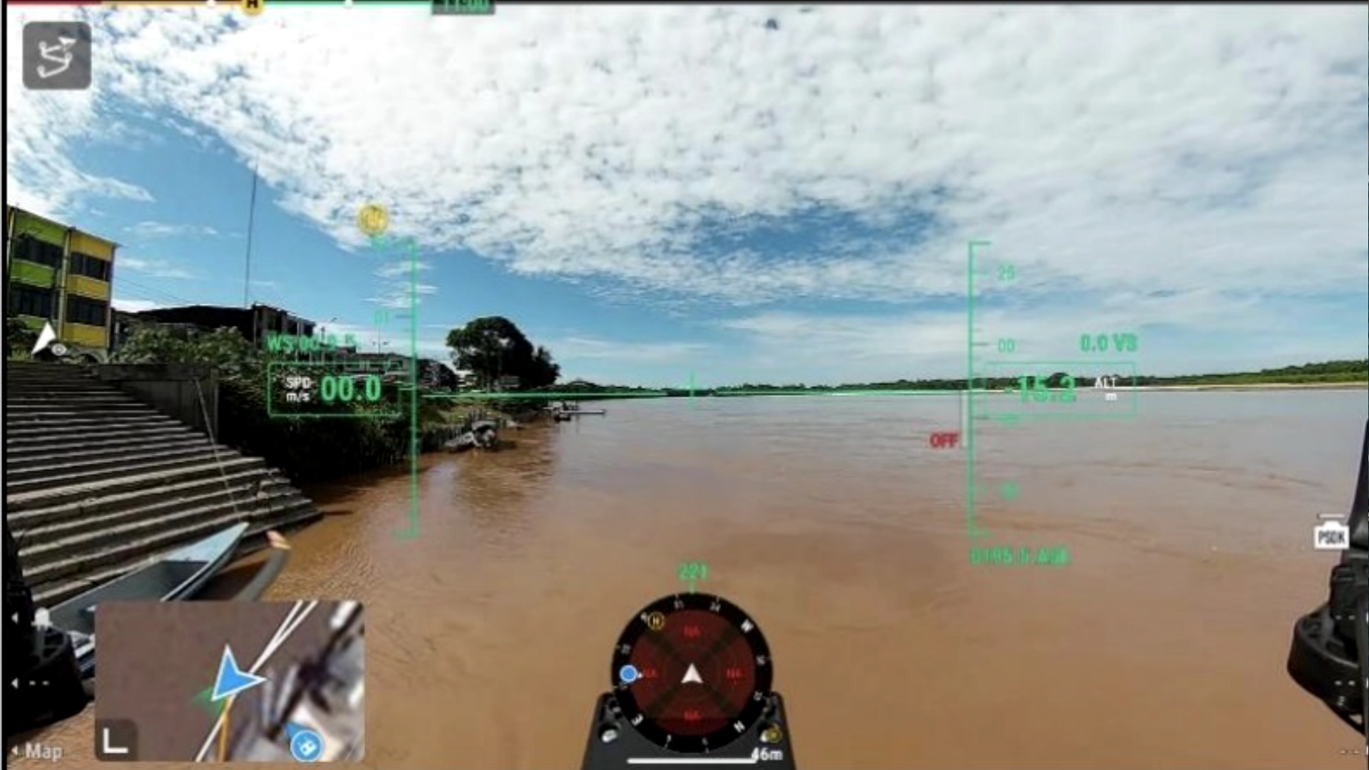 Drone camera view with flight display over a wide, sediment-laden river beside a riverside town and landing steps in Ecuador