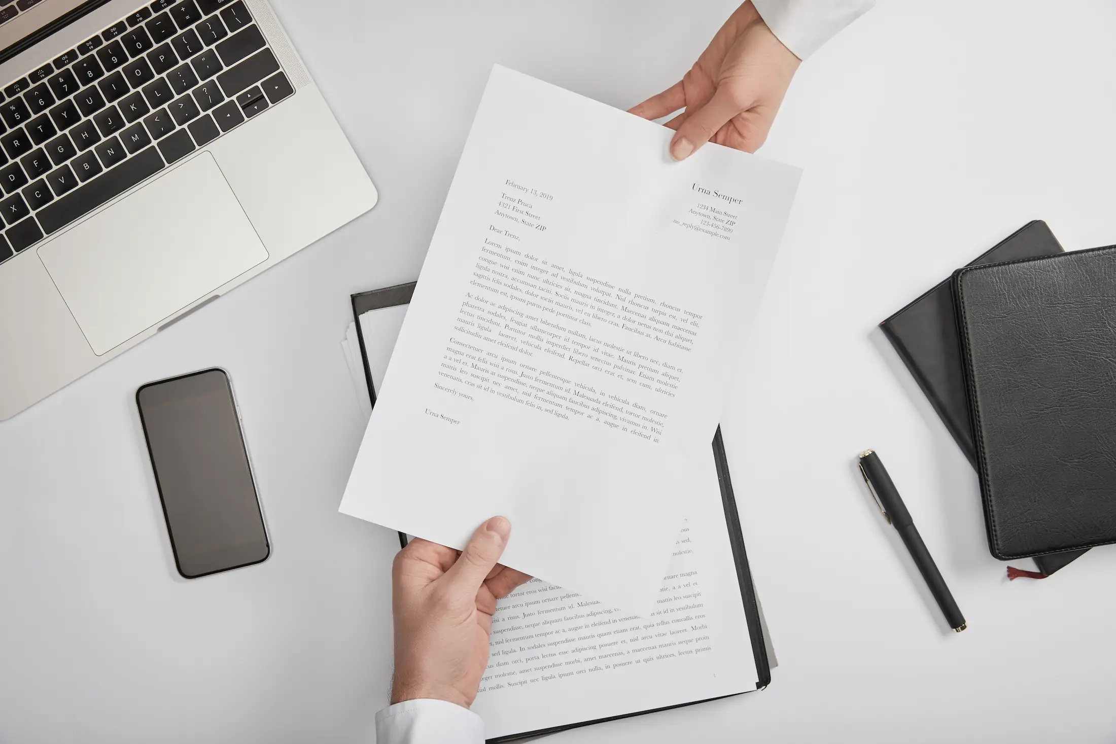 top view people exchanging resumes and cover letters