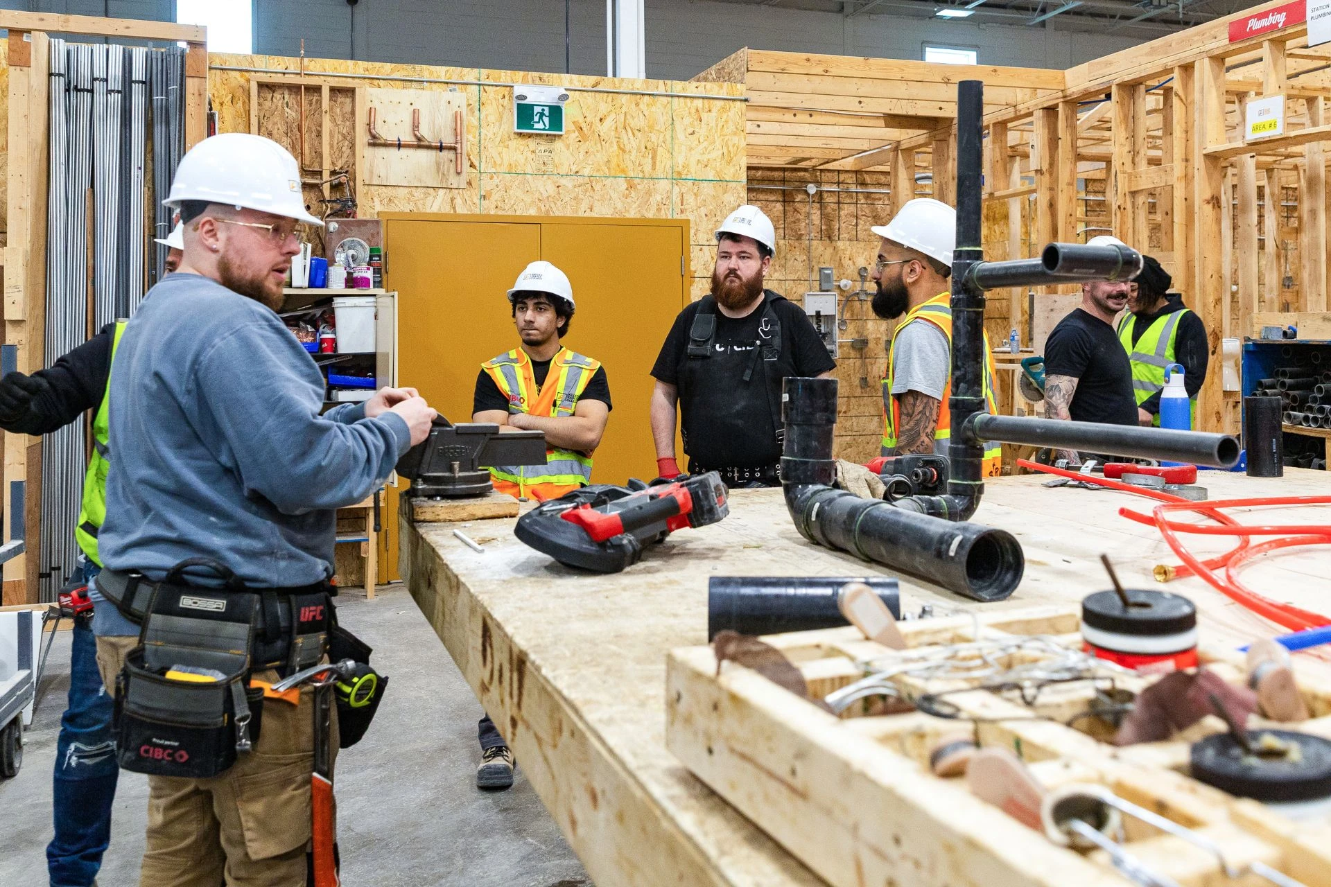 A group of tradespeople discussing a project