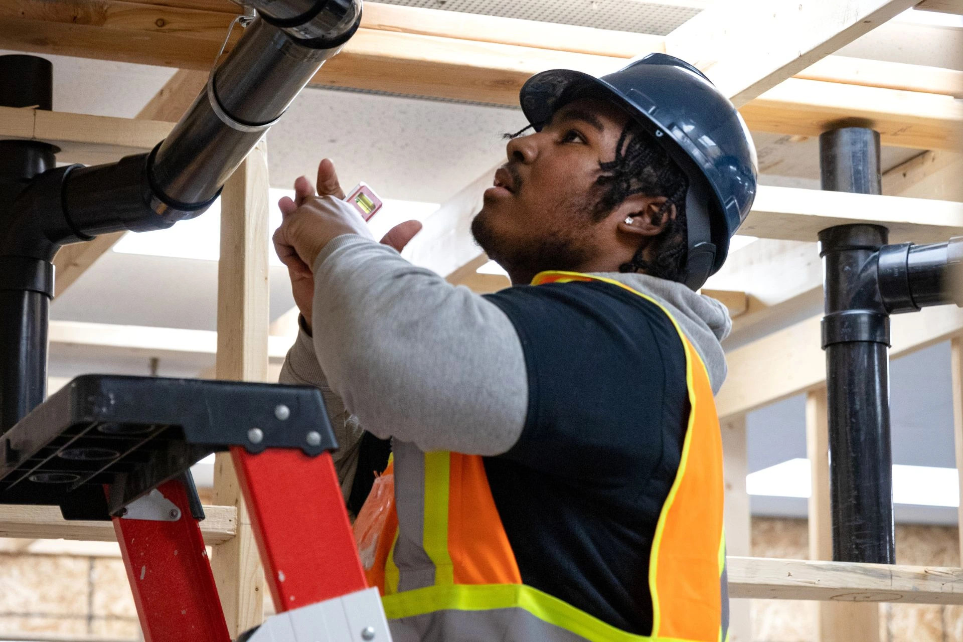  A person in a hard hat undergoing training