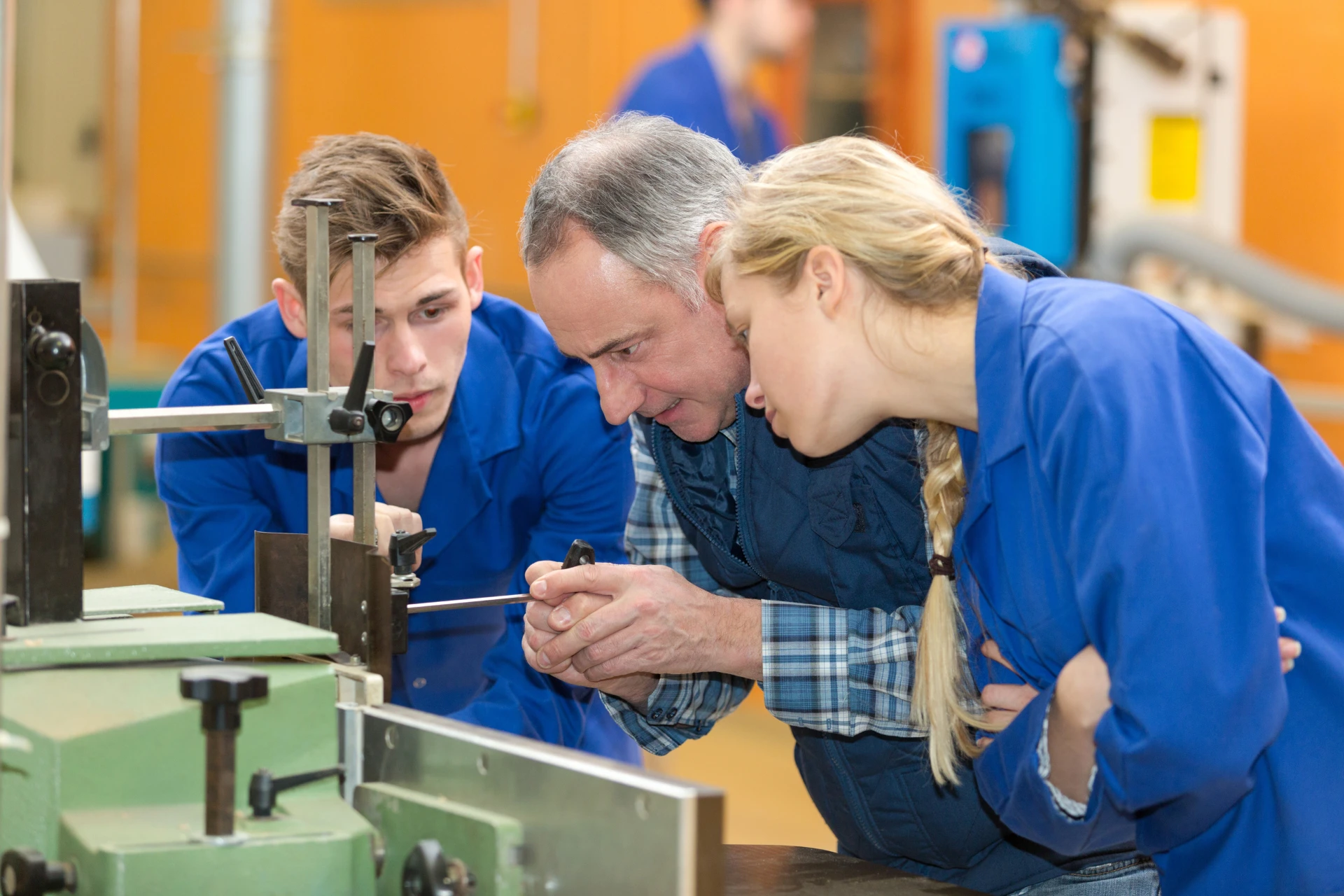 Trades students learning from an instructor in a classroom