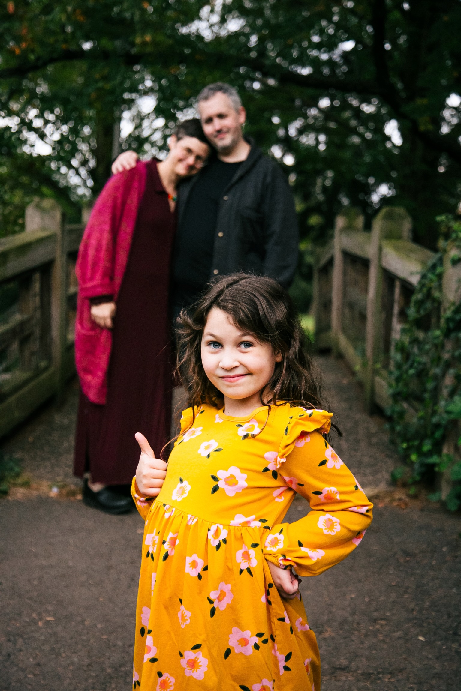 A cute family on a bridge