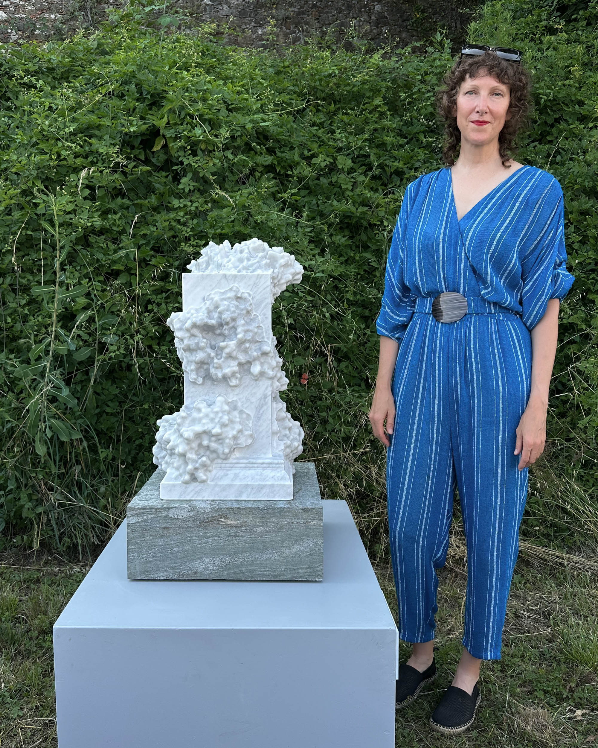 Laura Splan with "The Foragers" in "Per Forza di Levare" at Fortezza di Mont'Alfonso, 2026, robotically carved Bianco Carcaraia marble sculpture with hand-finishing, approx. 66 H x 31 W x 31 D cm