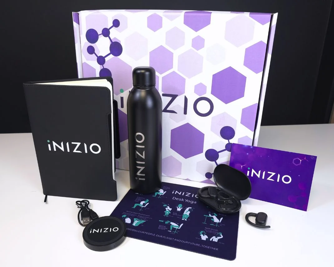 Inizio premium onboarding pack, box open with all five items