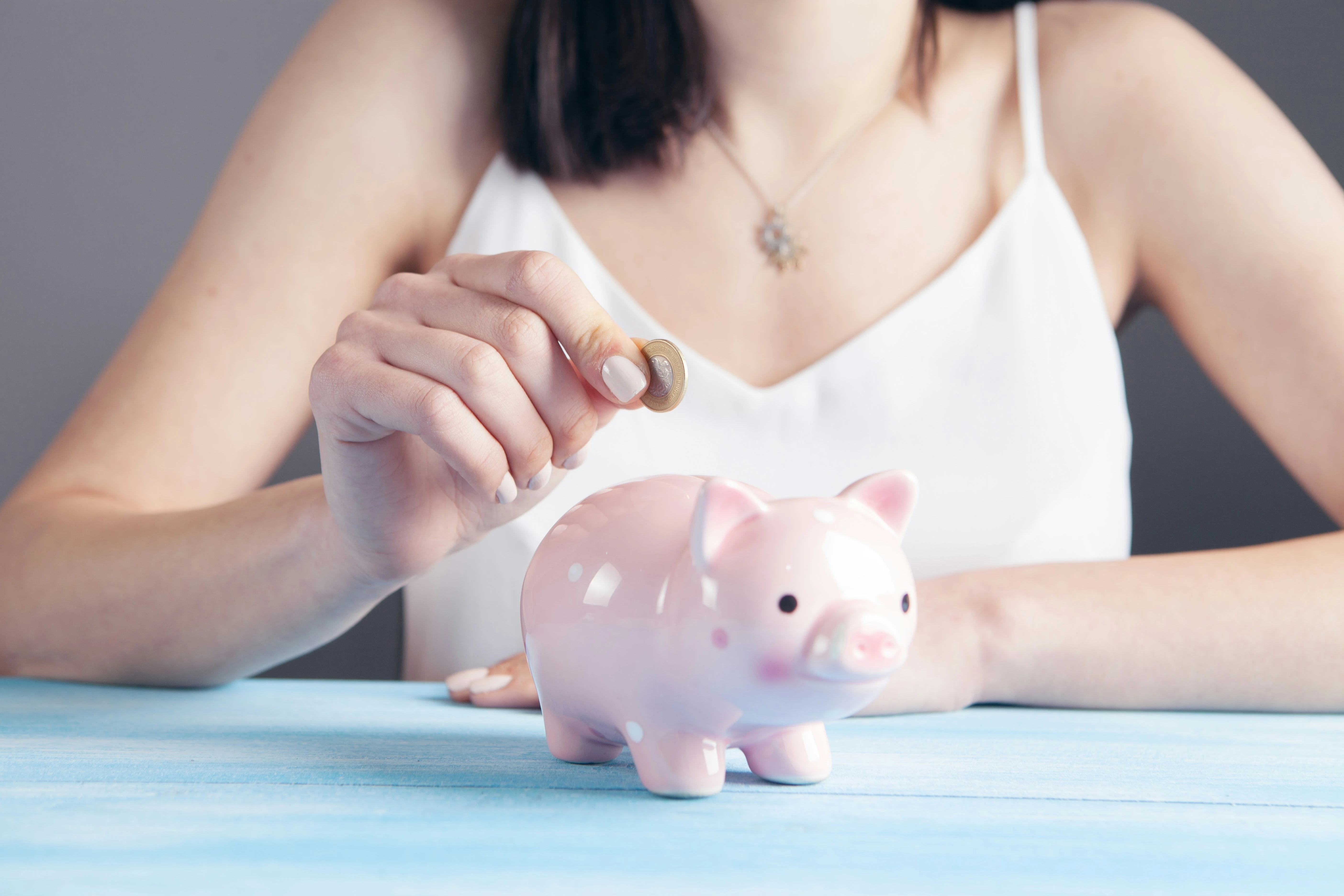 Classic piggy bank with coin