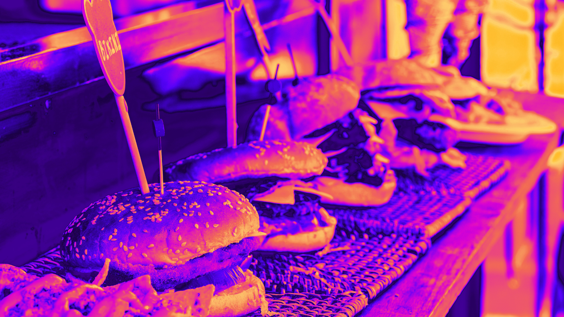 A delicious line of juicy burgers from a food truck. 