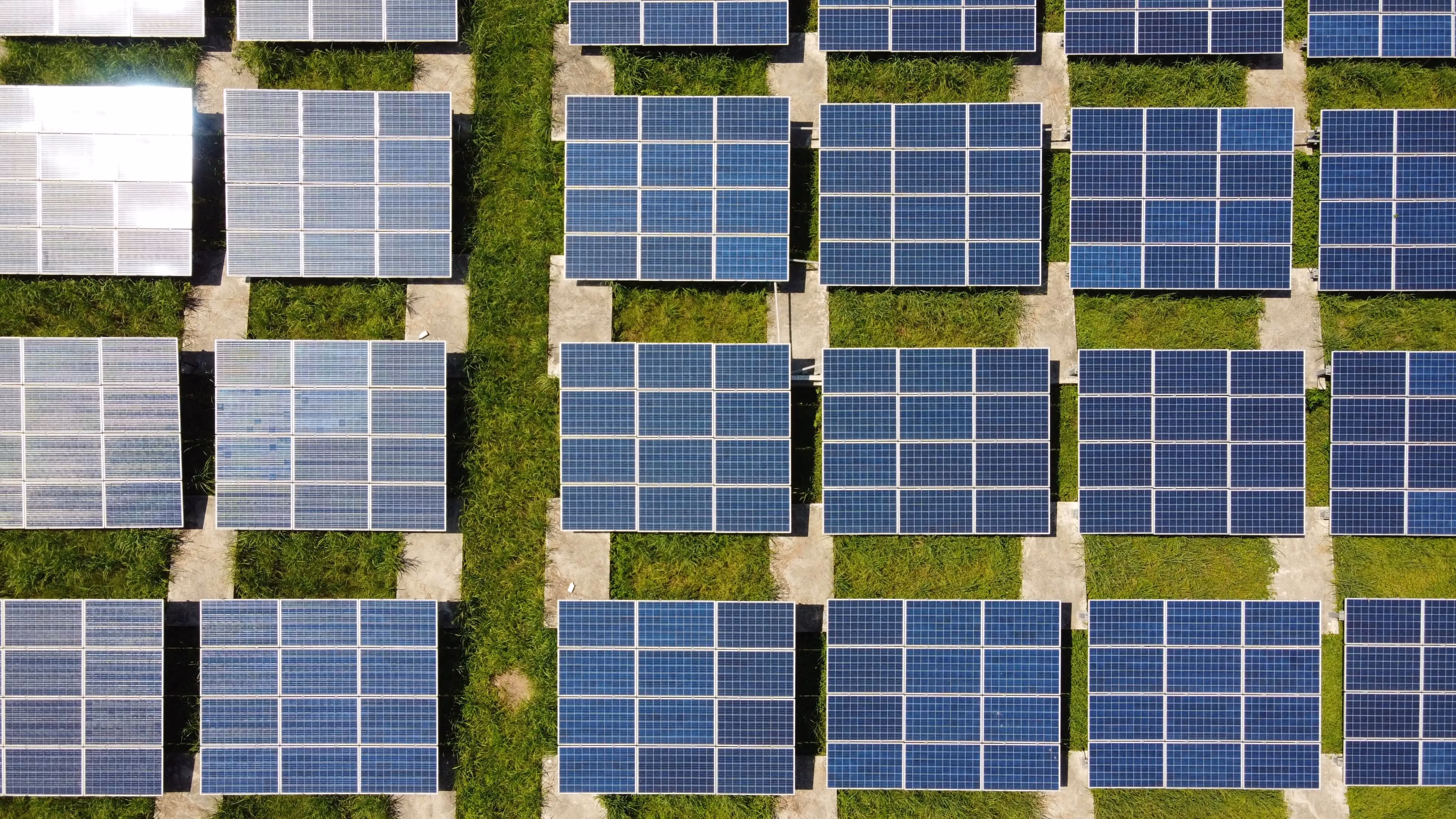 An aerial view of solar panels in a field.