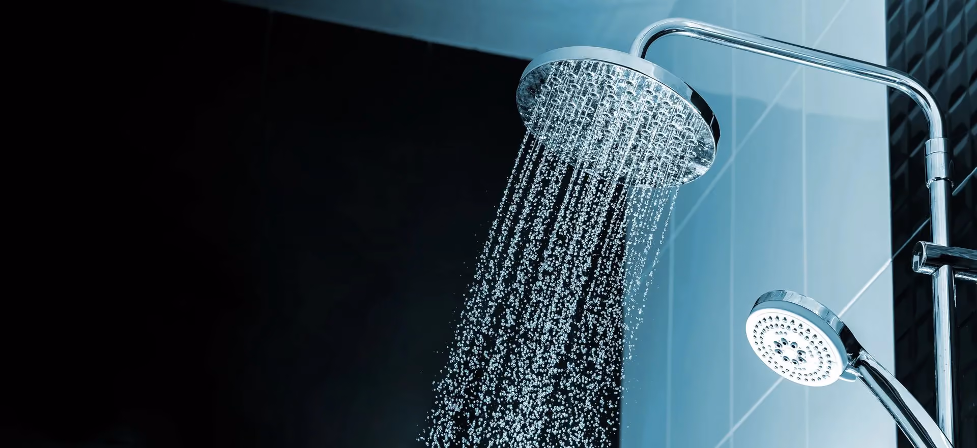 A shower head with water coming out of it.