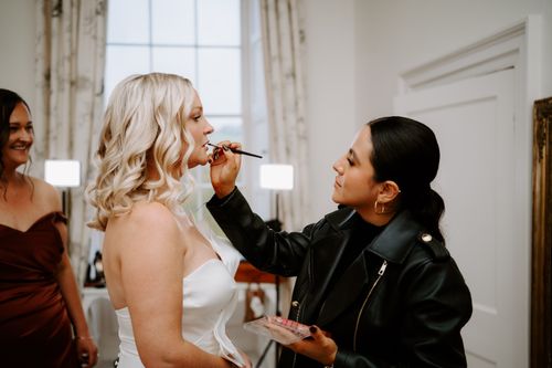 makeup artist applying makeup