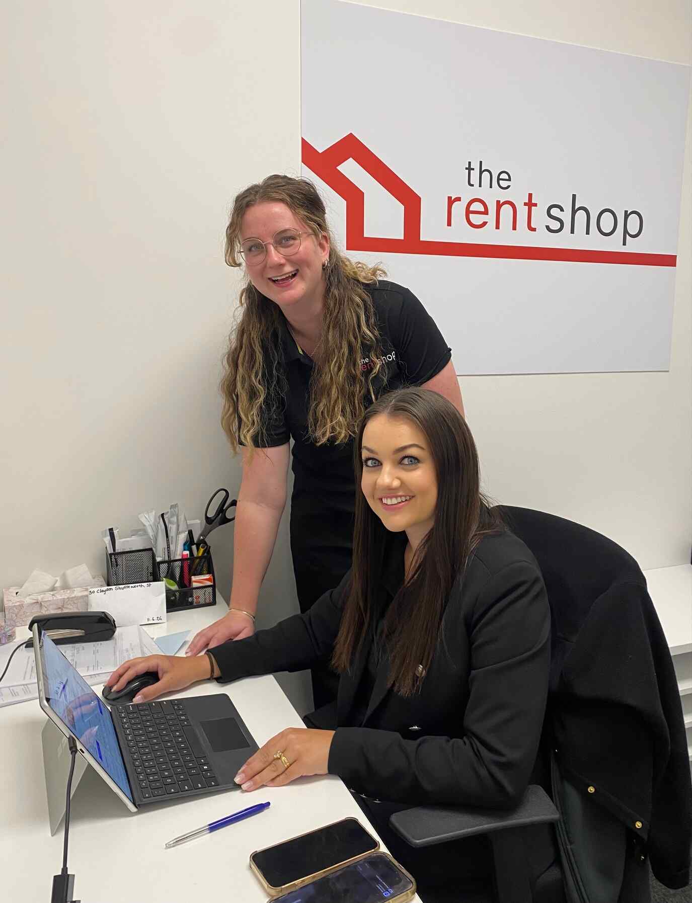 Two property managers smiling 
