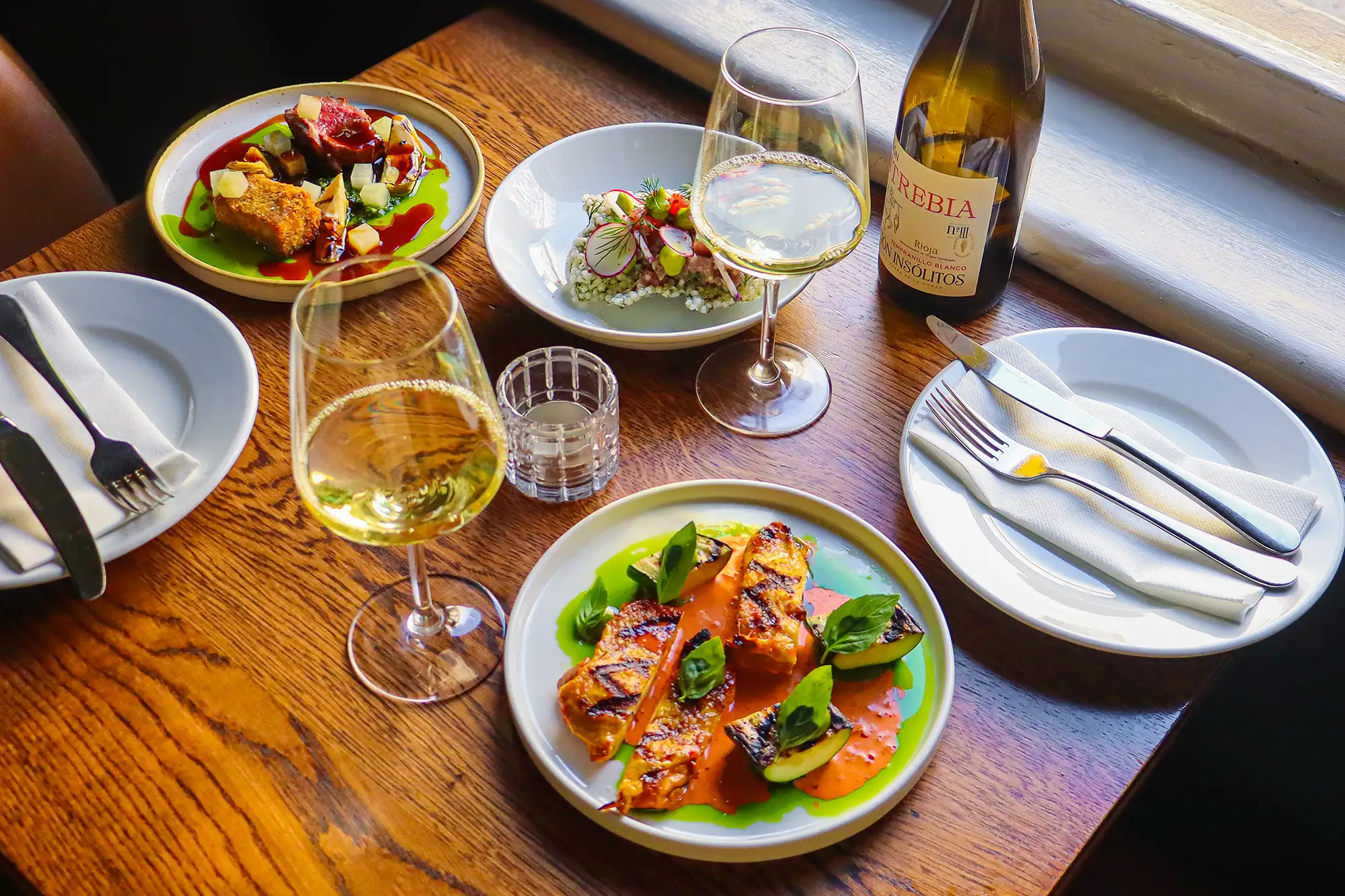 Opera Tavern is a lively, inviting tapas bar & restaurant in the heart of Covent Garden's theatre land. Downstairs, striking graphic prints by the likes of Ben Eine compliment the stylish bar, counter seating and communal table, with a warm and atmospheric first-floor dining space above.The perfect place to enjoy tapas in London, the Opera Tavern will transport you straight to the bustling bars and restaurants of Spain and Italy.
Head Chef Pavlin Karantatski for Opera Tavern and his team have created a menu of exciting Spanish and Italian-influenced dishes using the very best seasonal ingredients, alongside an extensive wine list and collection of regionally inspired seasonal drinks, from Spritz serves to long drinks.