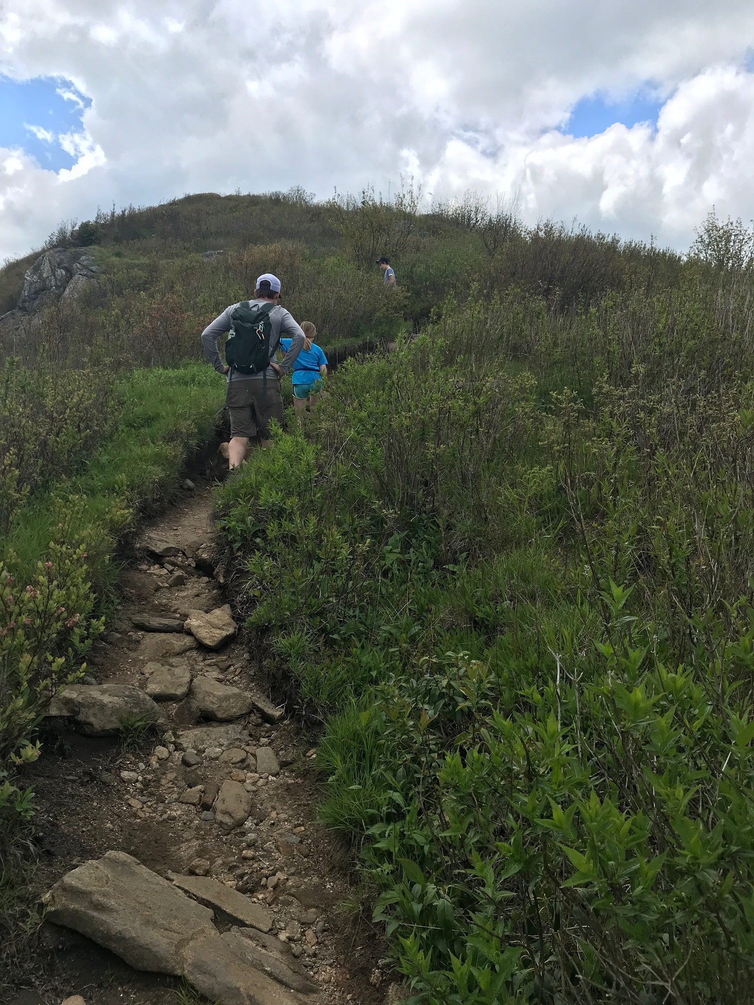 Wes walking up a mountain trail