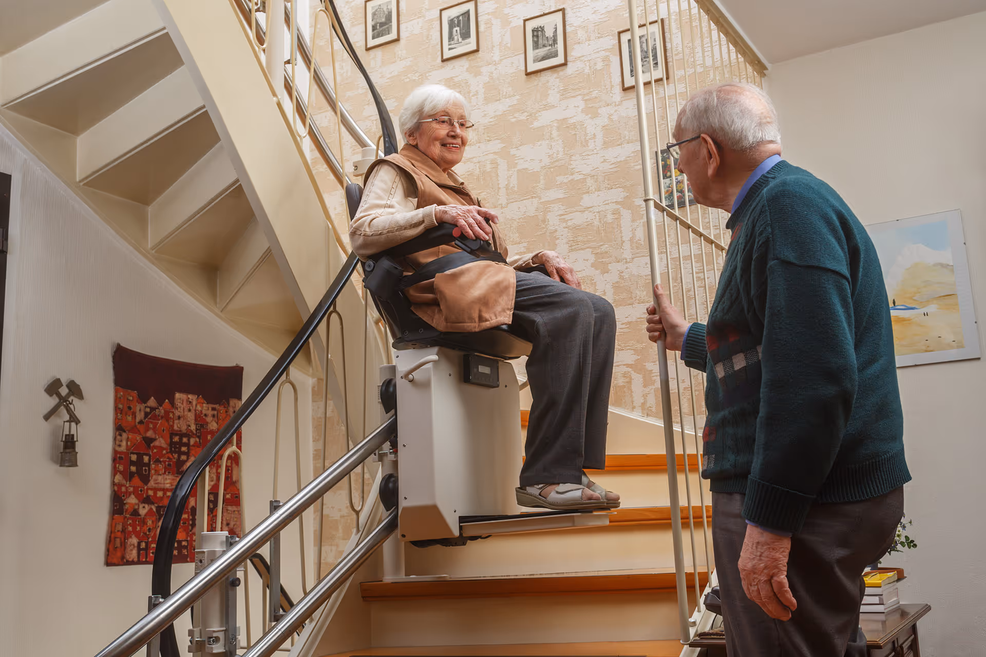 Residential stair lift installed along an indoor staircase, providing safe mobility assistance for elderly or disabled individuals.