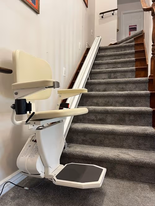 Residential stairlift installed on a staircase, providing safe and easy mobility assistance for individuals with limited mobility.