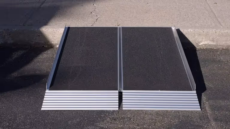Aluminum portable folding wheelchair ramp, compact and durable design for easy mobility and accessibility.