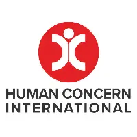 The Human Concern International logo features a red circle containing a white stylized human figure with arms raised, positioned above the organization's name in bold, black text.