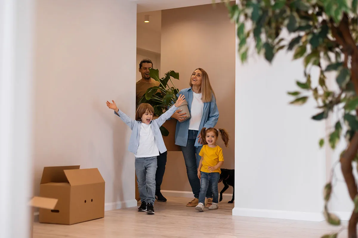 Happy family with dog moving new home
