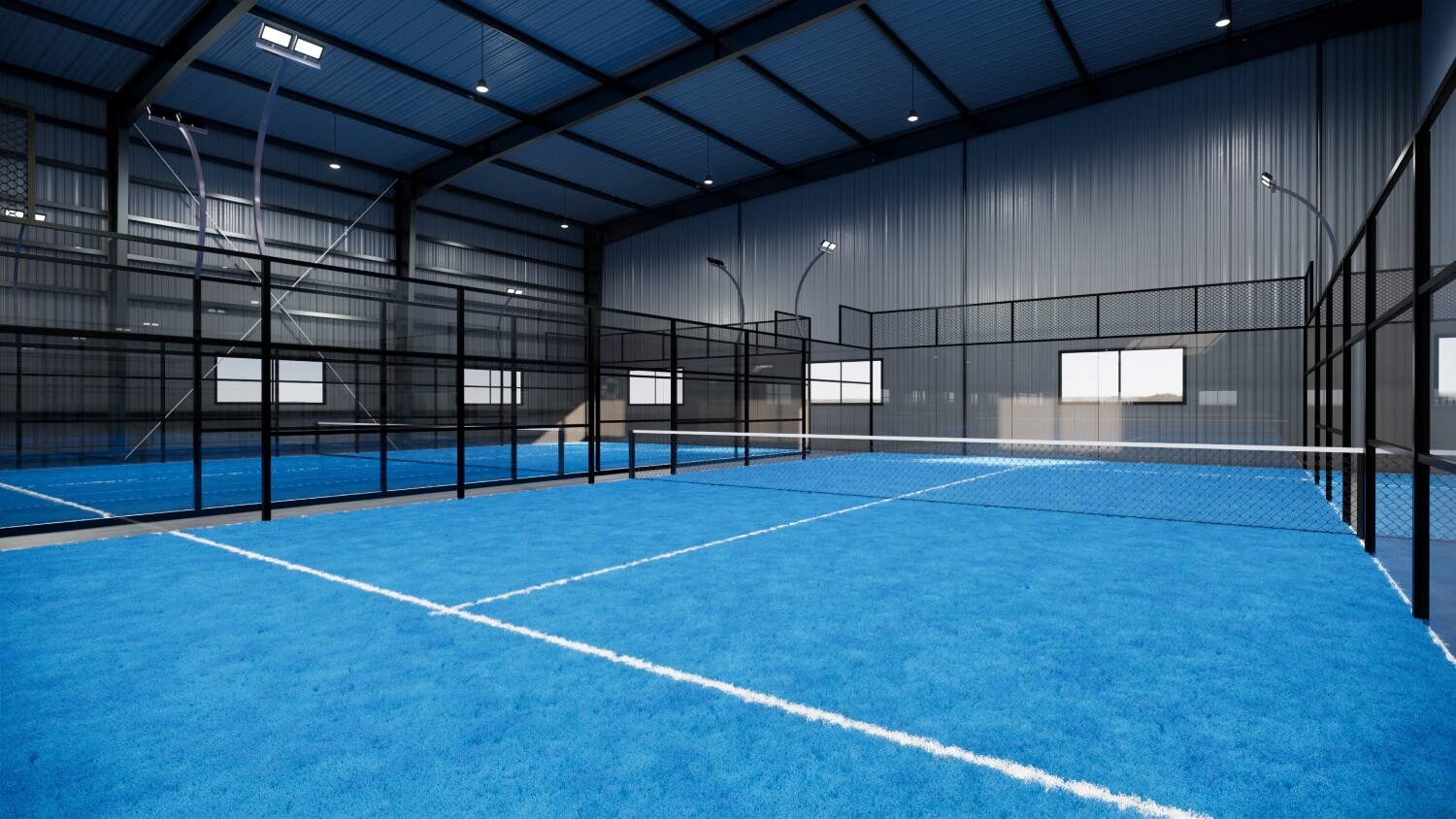 Padel-Platz in einer Padel-Halle mit Gaswänden und blauem Boden