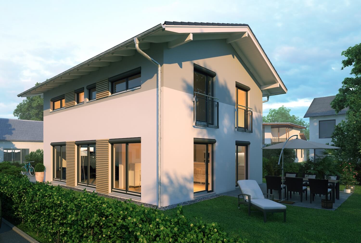 Modernes Einfamilienhaus in einer Wohnsiedlung in der Abenddämmerung