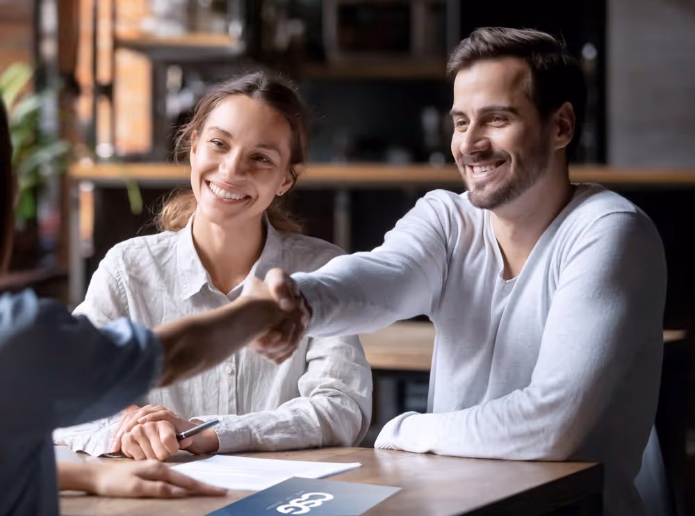 Happy young family being taken care of by CSG team
