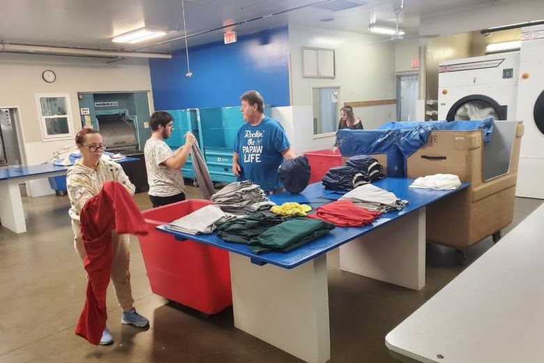 The HRC laundry team sorting and processing linen