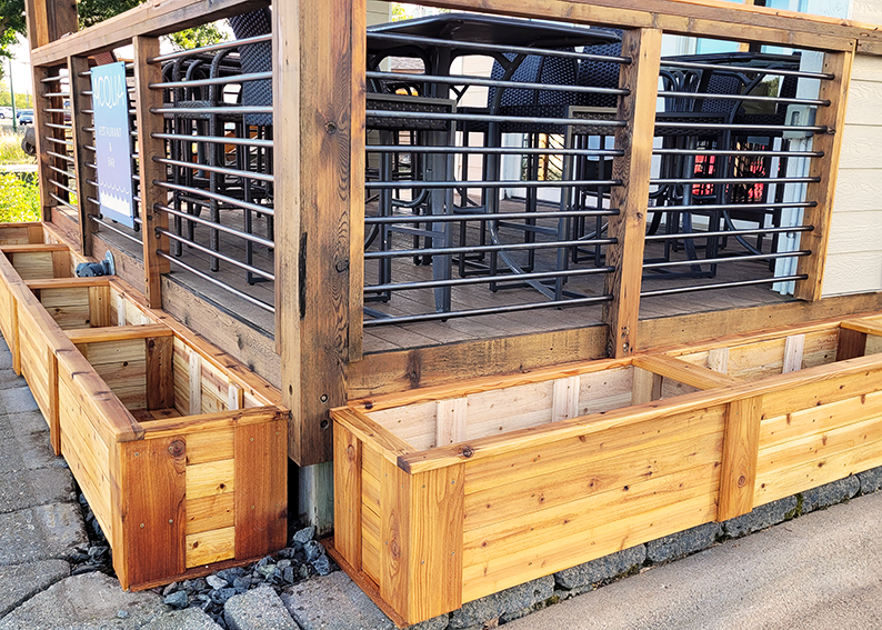 Garden beds that wrap around the Acqua Restaurant and Bar in White Bear Lake, Minnesota