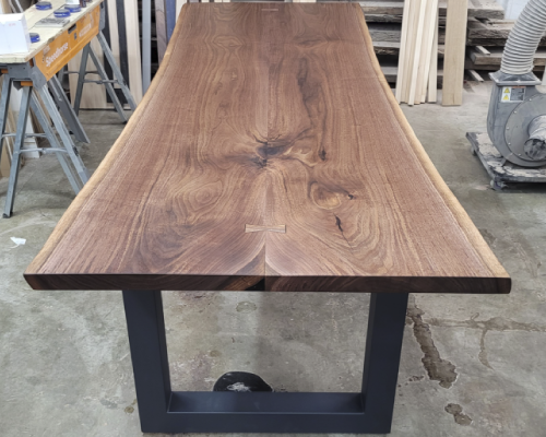 Walnut book match set dining table.