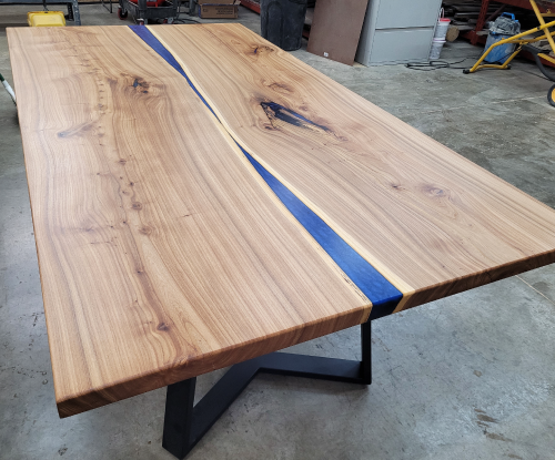 White oak blue epoxy river table. 