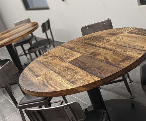 Reclaimed oak and elm break tables for Northland Concrete and Masonry (NCM).