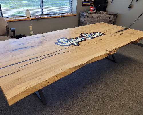 American Elm Conference Table with logo engraved for Super Siders.