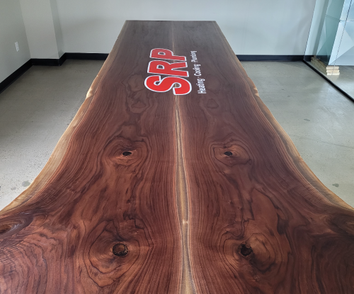 Bookmatch conference table with SRP Logo Engraved. 