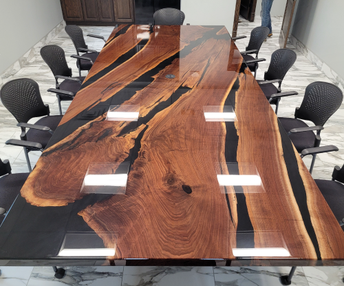 Walnut and black resin conference table.