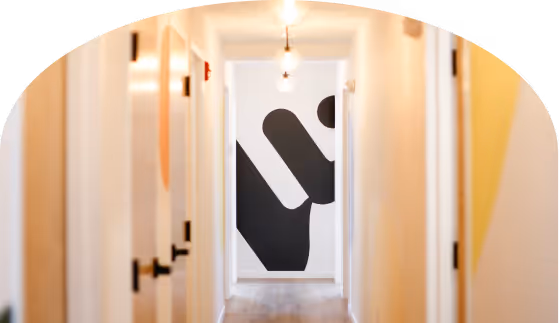 View of bright knownwell clinic hallway with logo symbol