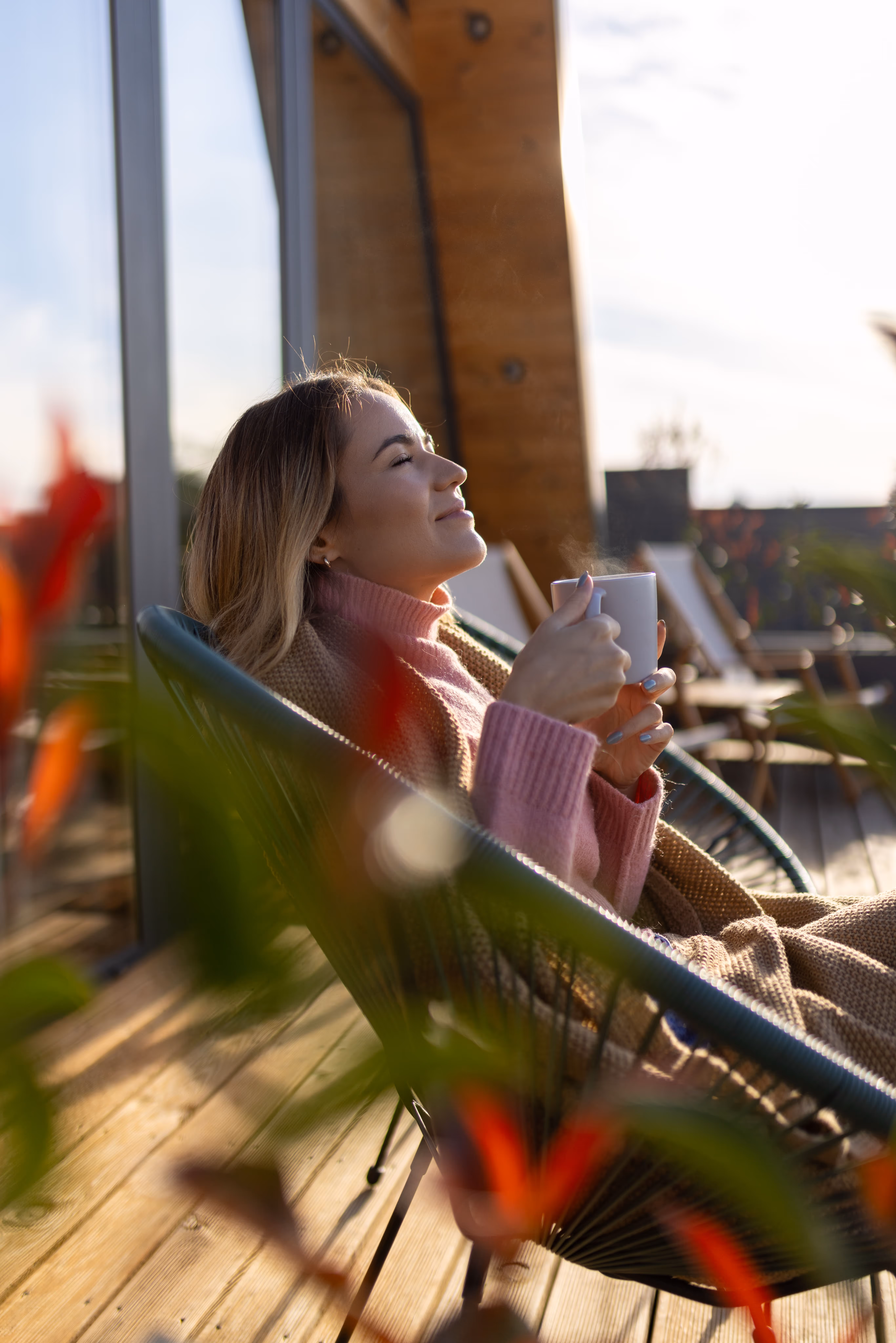 Image of woman enjoying coffee outdoors