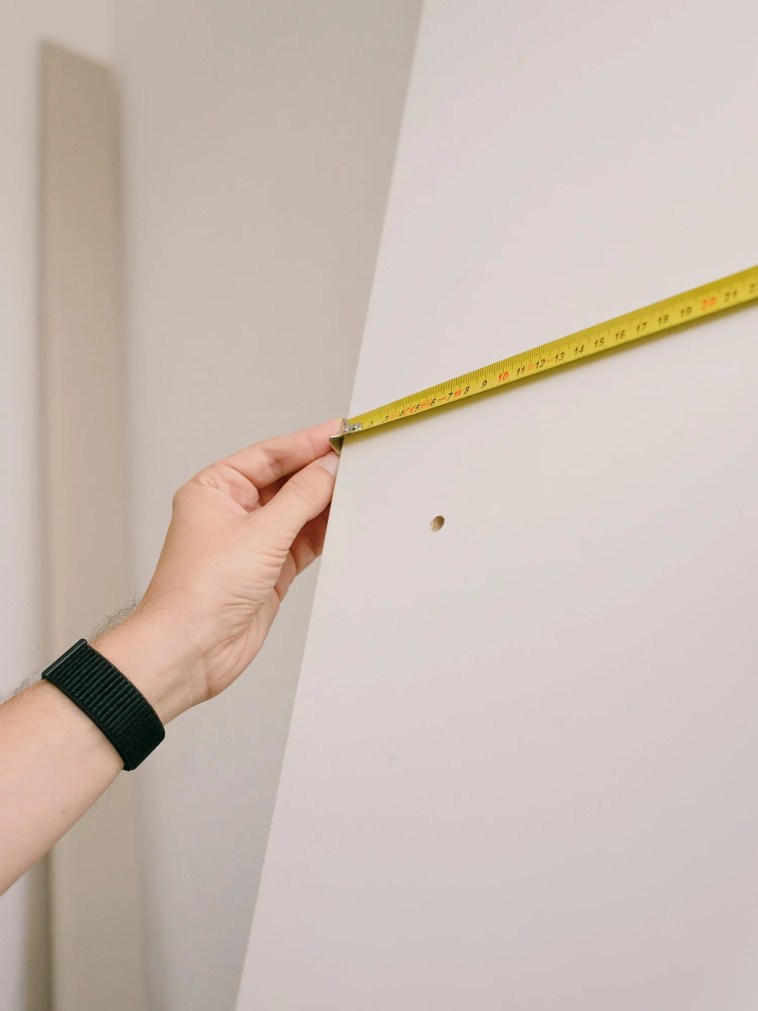 Measurements are made by hand with a measuring tape.