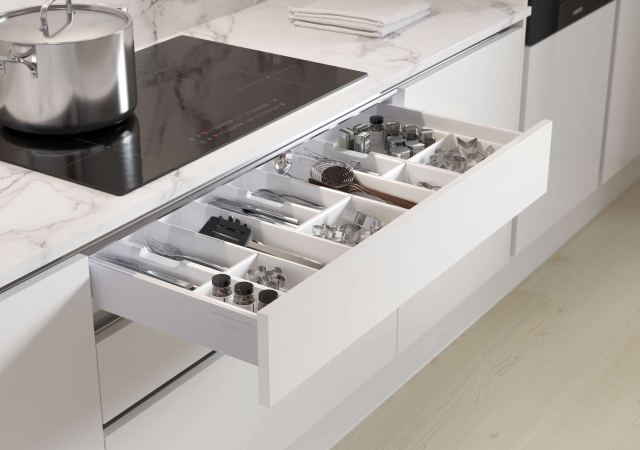 A cutlery organizer in the drawer under the cooktop