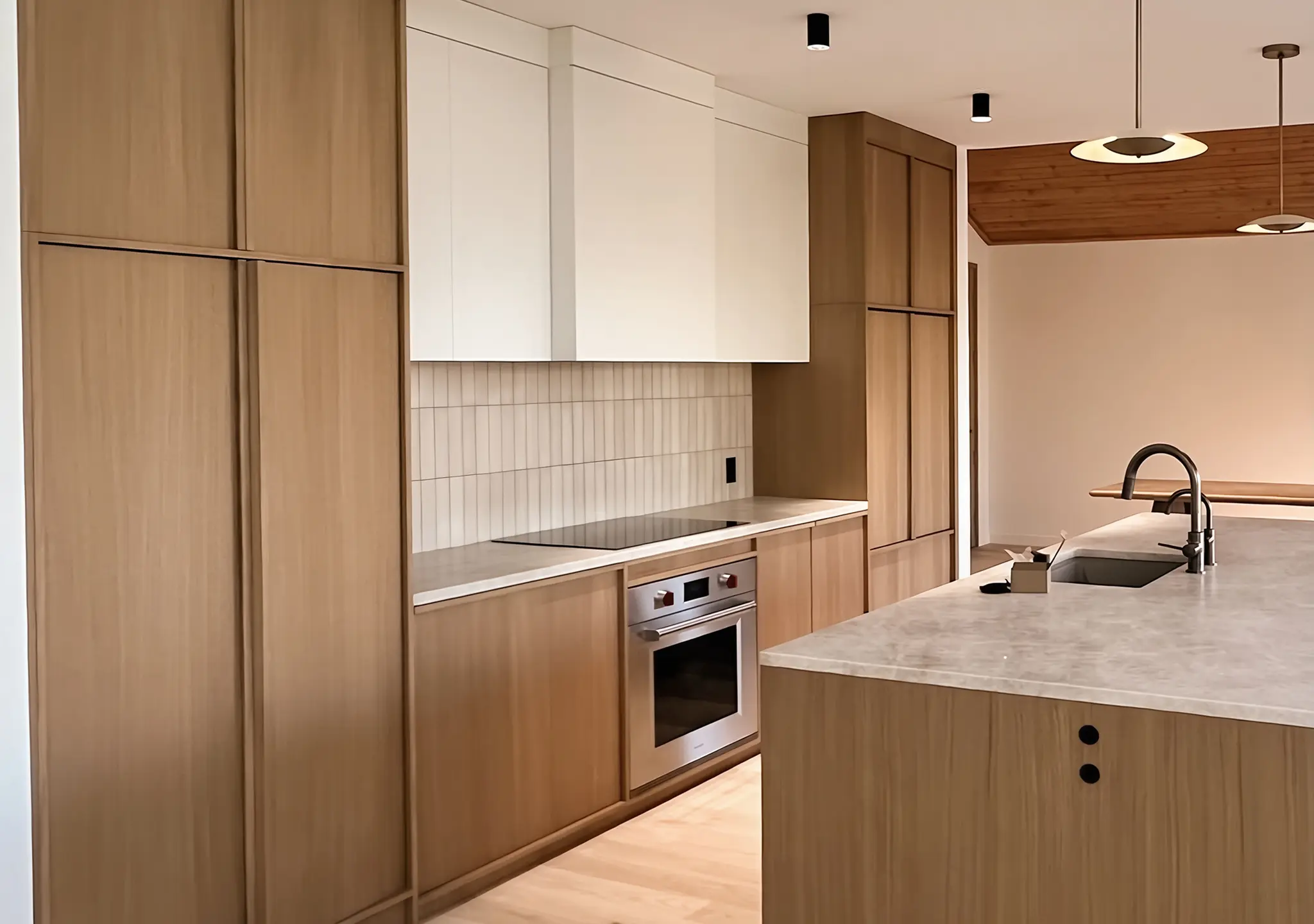 Oak kitchen with a stone island and a window with a view