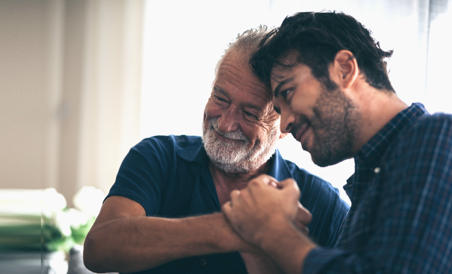 An older patient with his adult son
