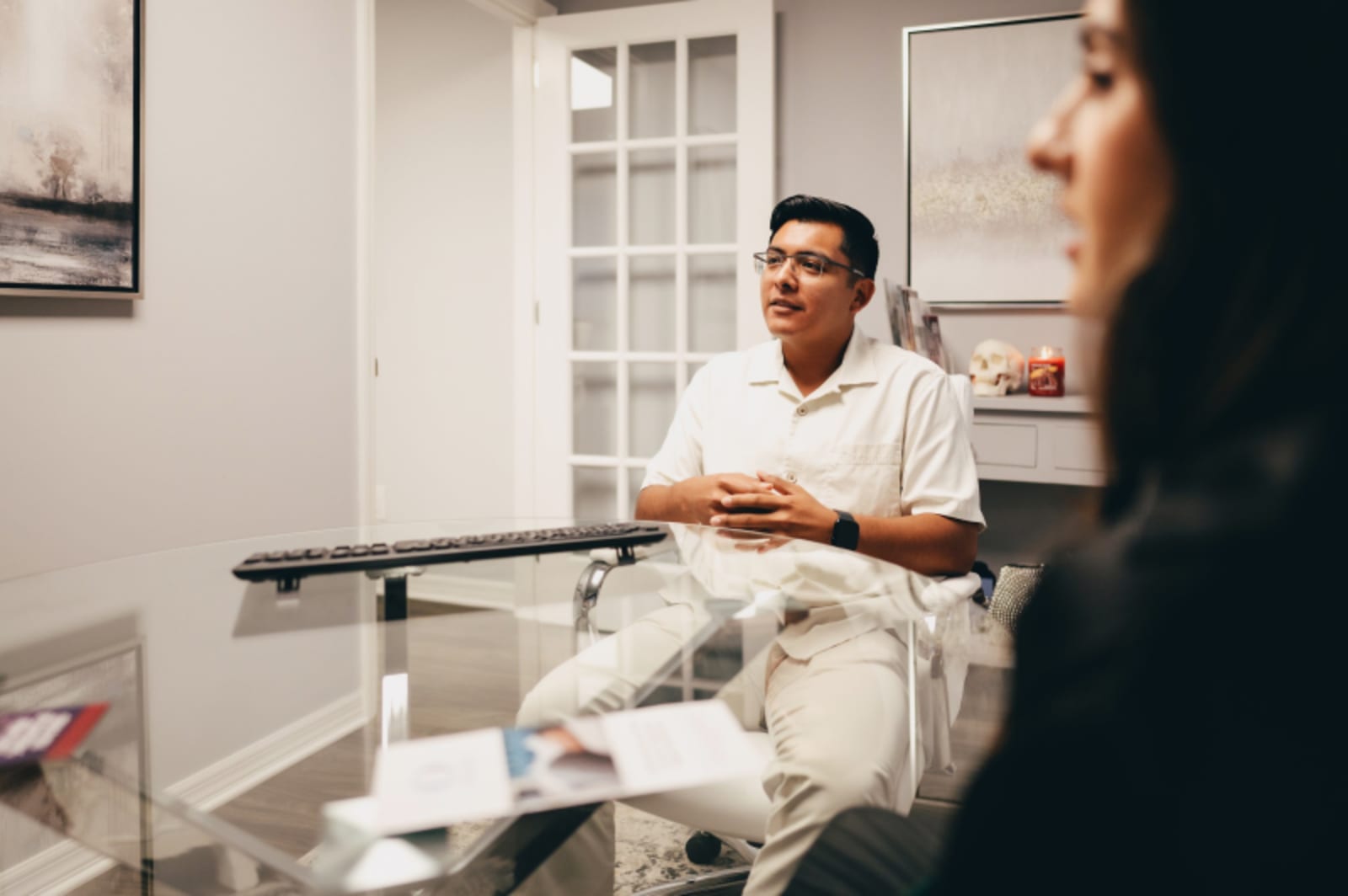 Dentist showing patient digital imaging results on computer monitor during consultation