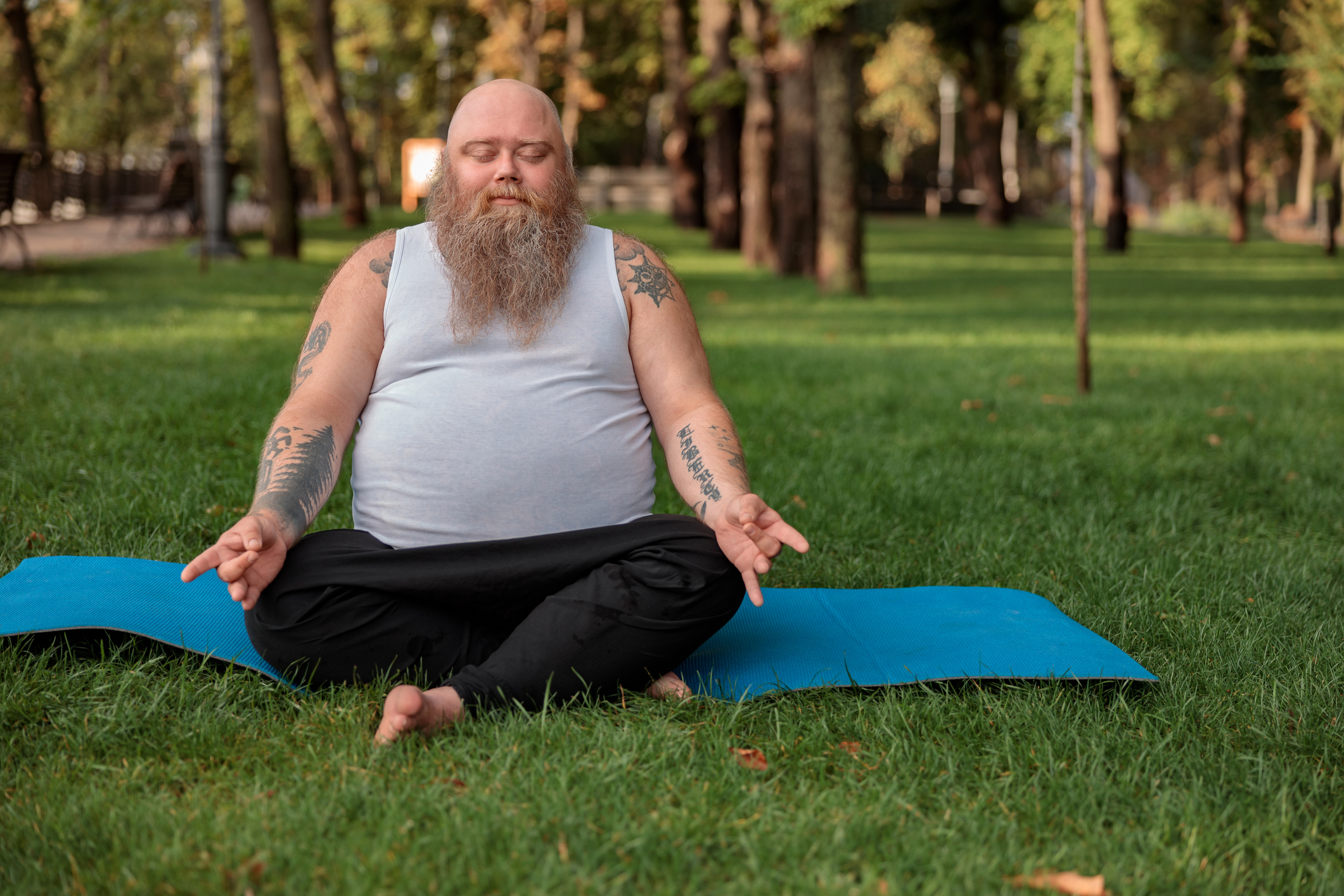 Man sitting in park meditiating